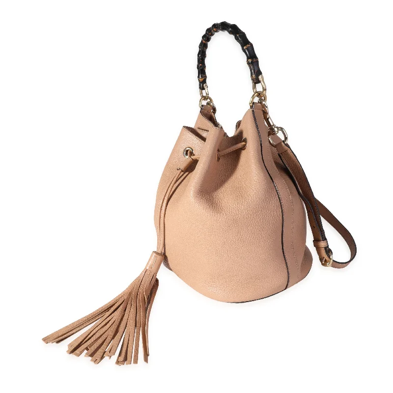 Women Gucci Sylvie bags with a monogram - embossed leatherGucci Beige Pebbled Leather Miss Bamboo Bucket Bag