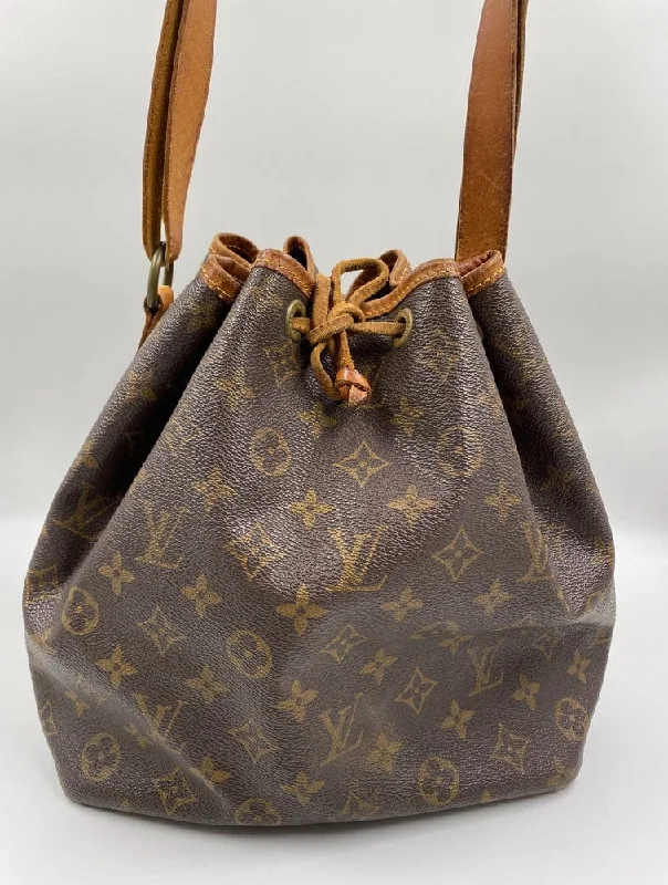 Louis Vuitton bags with a snap - button closure and a decorative charm for styleLouis Vuitton Petit Noé Bag