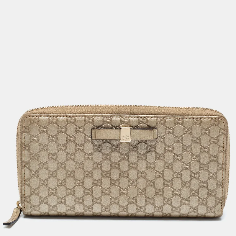 Ladies Gucci Dionysus bags in a pastel colorGucci Metallic Beige Microguccissima Leather Bow  Zip Around Wallet