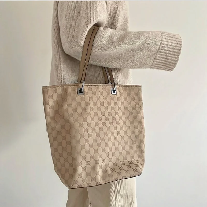 Women Gucci bags with a magnetic snap closure for easy accessGucci Beige Jacquard Tote