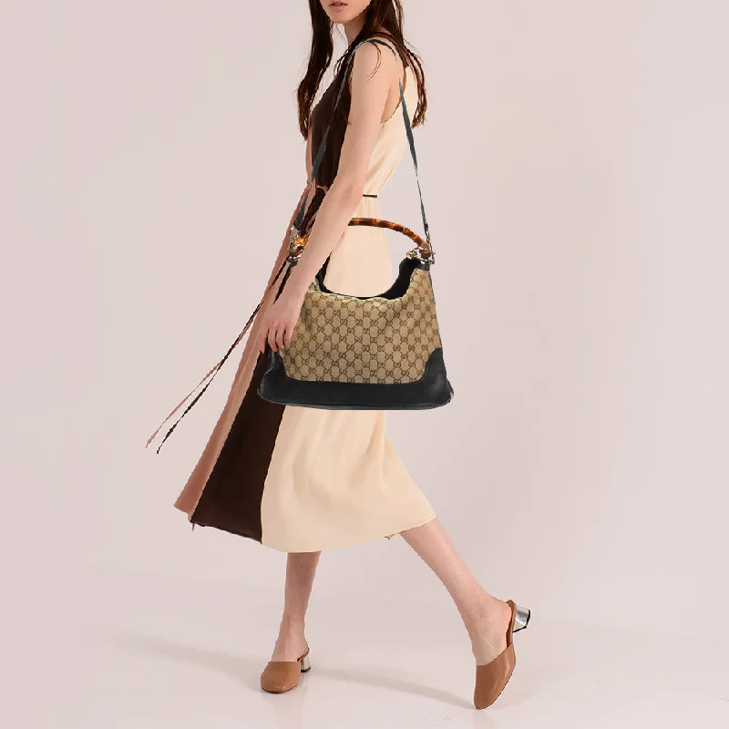 Ladies Gucci Dionysus bags with a star - shaped charmGucci Beige/Ebony GG Canvas and Leather Bamboo Shoulder Bag