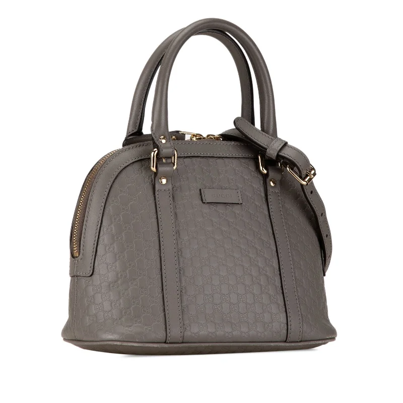 Women Gucci bags with interlocking G hardware for a classic lookGucci Mini Microguccissima Dome