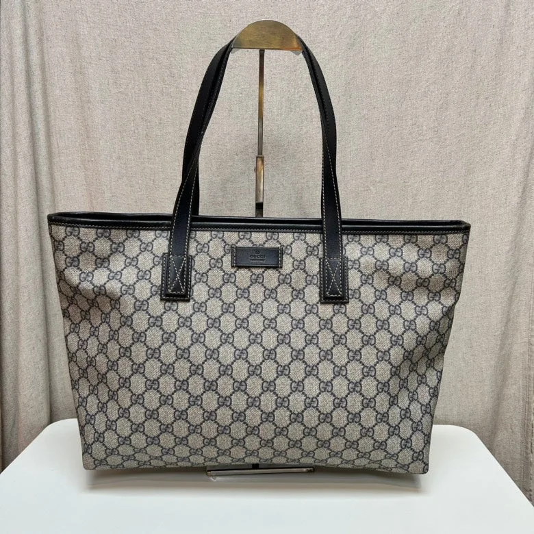 Gucci Marmont bags for women with a contrast - colored interiorGucci Monogram Canvas Black Leather Trim Tote