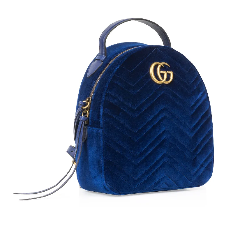 Women Gucci bags with a snap - button closure and a decorative charmGucci Marmont Backpack