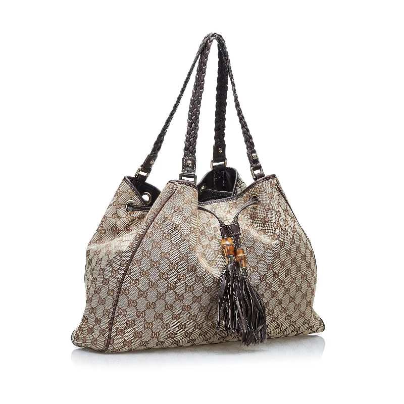 Ladies Gucci shoulder bags with a tassel decorationGucci GG Canvas Peggy Tote (SHG-WItI8D)