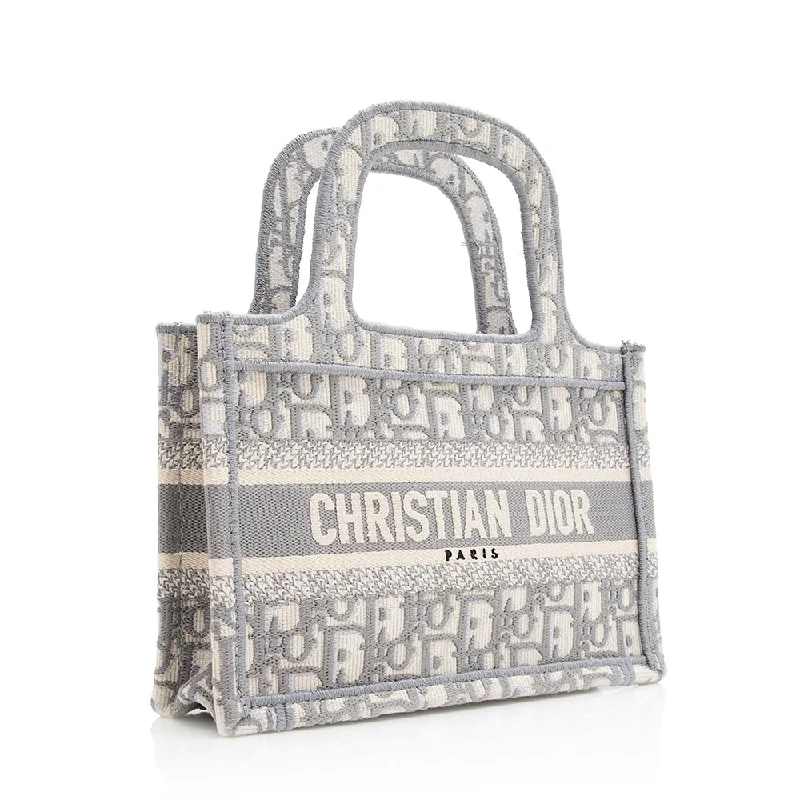 Christian Dior handbags with a snap - button closure and a decorative buckleChristian Dior Oblique Mini Book Tote