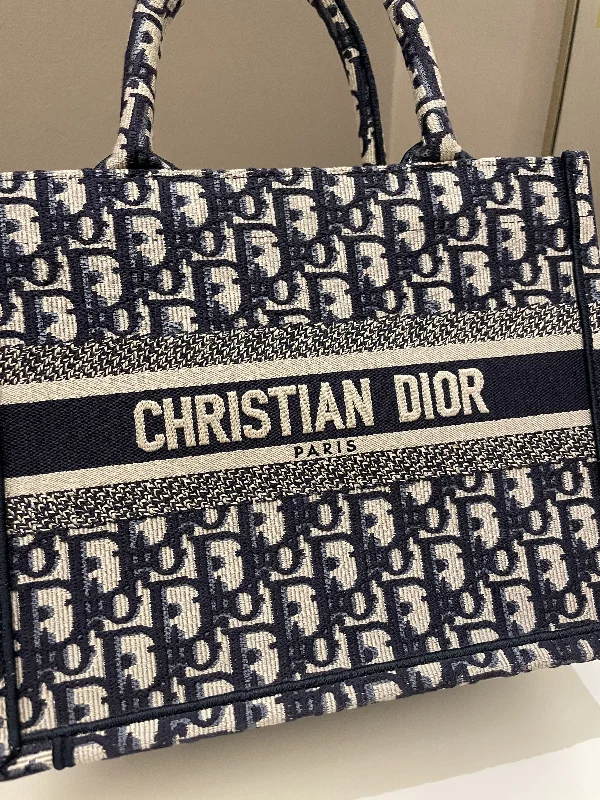 Christian Dior bags with a side - pocket for holding a water bottleDior Book Tote Navy Oblique